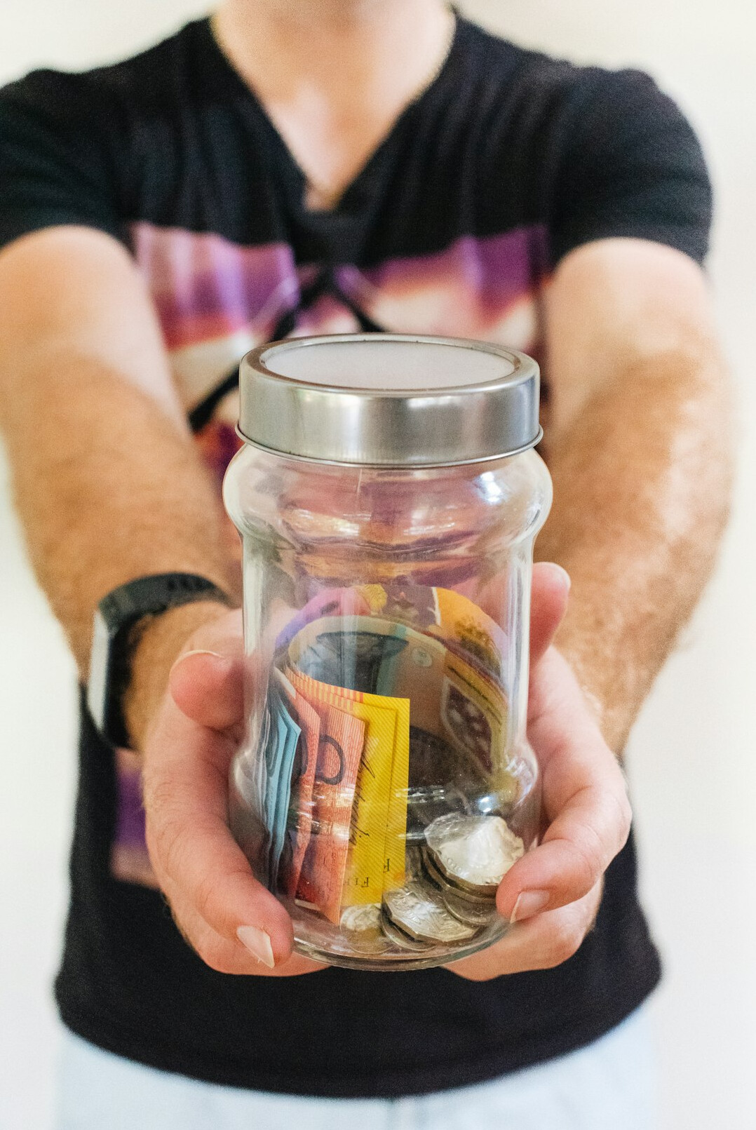 savings jar with coins