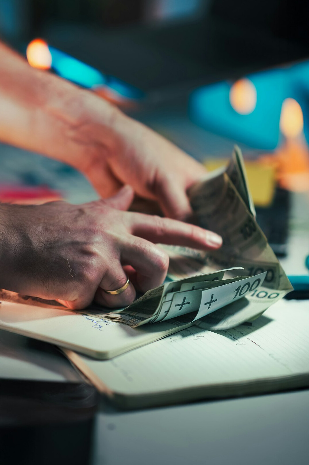 person calculating debts on computer